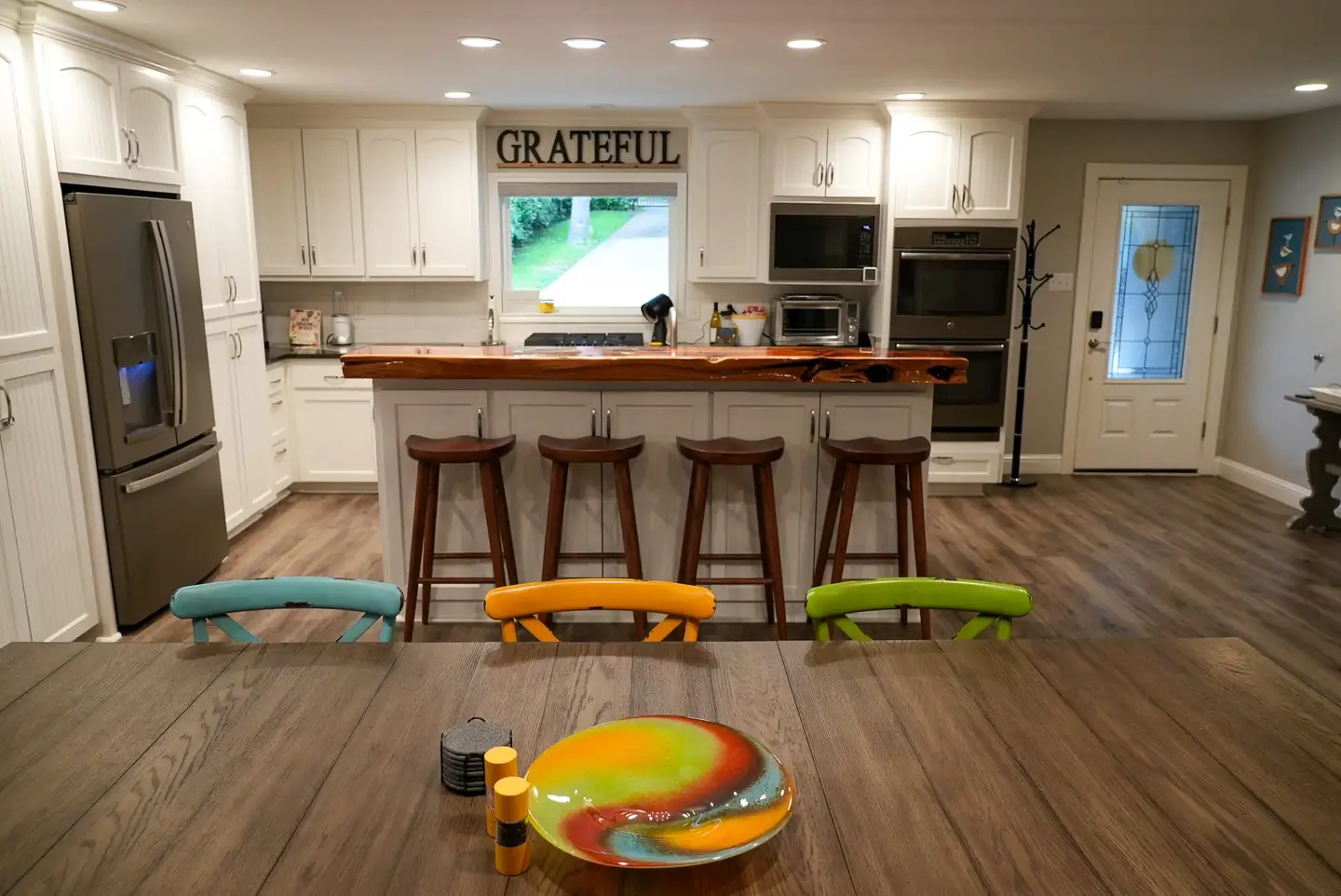 View of the kitchen and bar stools from the dining room